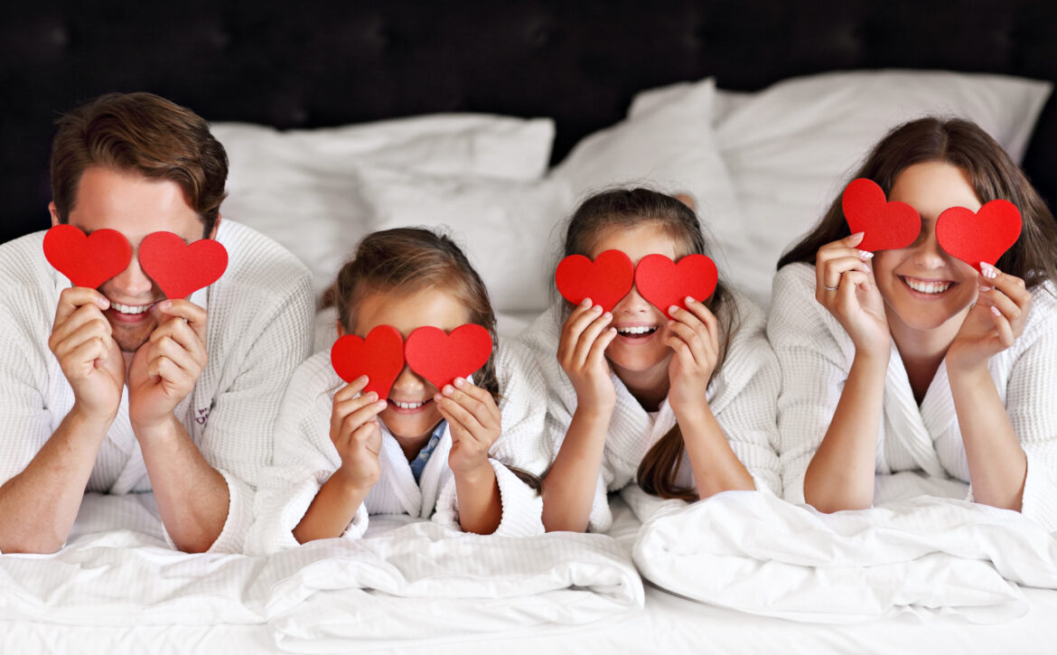 Happy family relaxing in hotel room